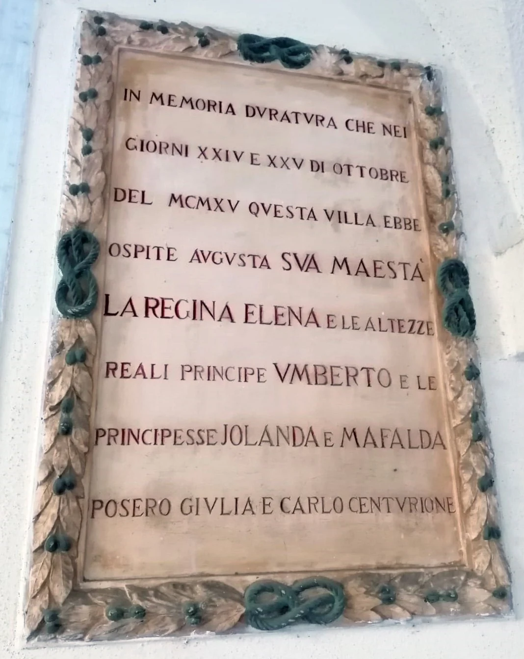 The historic plaque on the villa